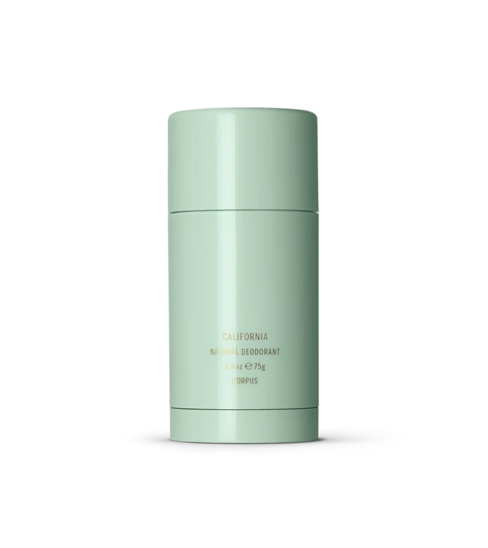 Mint green cylindrical deodorant bottle with gold text reading California Natural Deodorant Corpus (2.6 oz).