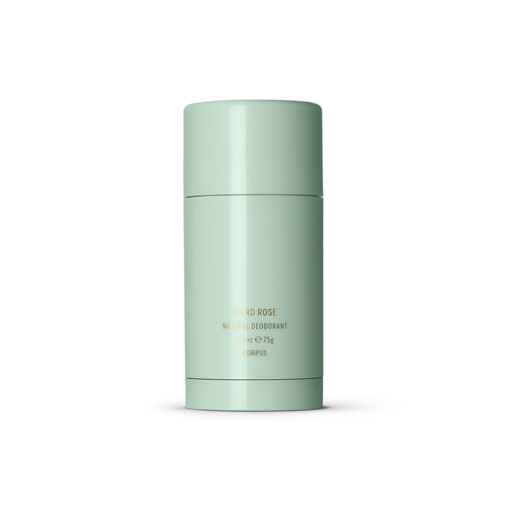 Mint-green cylindrical natural deodorant container with gold text reading Third Rose / Corpus on the front.