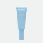 Blue sunscreen tube labeled 'DARLING' with SPF 50+ standing upright against a pale background, showing 'GLOWY SCREEN' text.