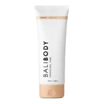 White tube of gradual tan lotion, labeled 'Body Gradual Tan' with a peach-cap at the bottom and a light peach band near the top; 200 ml container.