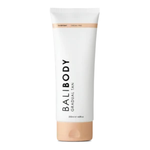 White tube of gradual tan lotion, labeled 'Body Gradual Tan' with a peach-cap at the bottom and a light peach band near the top; 200 ml container.
