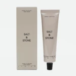 Beige box and matching beige hand-cream tube labeled Santal & Vetiver, standing side by side on a white background.