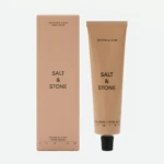 Beige box and matching tube packaging for Salt & Stone hand cream (Saffron & Cedar).
