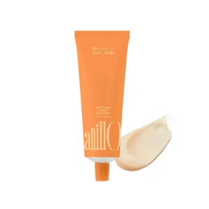 Orange squeeze tube of hand cream with white text on the front, standing upright on a white background.