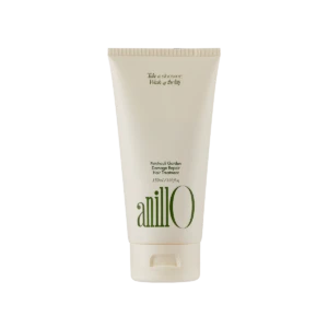Cream-colored tube of Anillo Patchouli Garden Damage Repair Hair Treatment (150 ml) shown upright, front view with green logo text on the bottle.