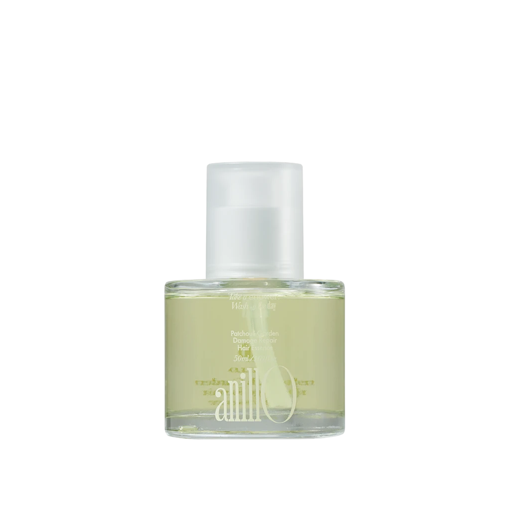 Perfume bottle with pale yellow liquid and a white spray cap on a white background, angled to the left.