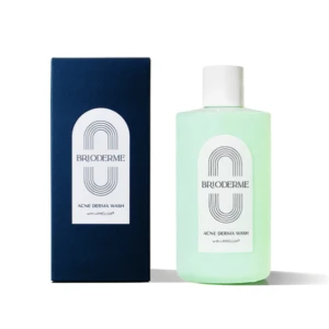 Blue box beside a mint-green BRIODERME Acne Derma Wash bottle with a white label on a white background.