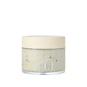 Cream-colored lid on a glass jar of bath salt with speckled crystals visible through the clear body; brand name 'anillo' on the label