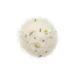 Round mound of white bath salts with dried chamomile petals and herbs