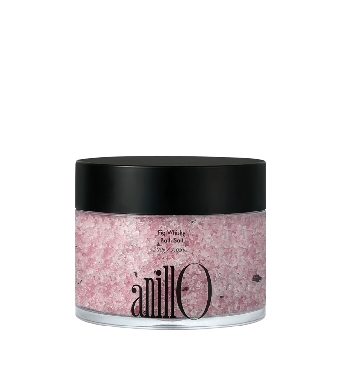 Pink Fig Whisky Bath Salt in a clear jar with a black lid; brand name Anilo visible on the jar.