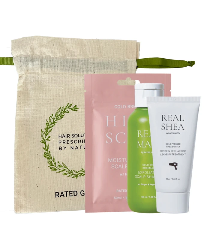 Natural hair care gift set: beige canvas pouch with green strap plus pink sachet, green bottle, and white tube labeled Real Shea