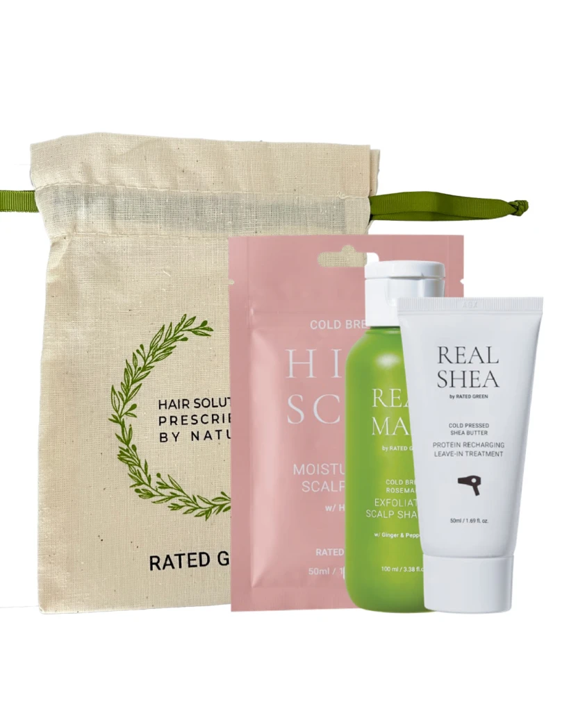 Natural hair care gift set: beige canvas pouch with green strap plus pink sachet, green bottle, and white tube labeled Real Shea