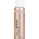 Balibody Instant Tan spray bottle in rose-gold with white cap, labeled Medium-Dark wash-off (informational product shot).