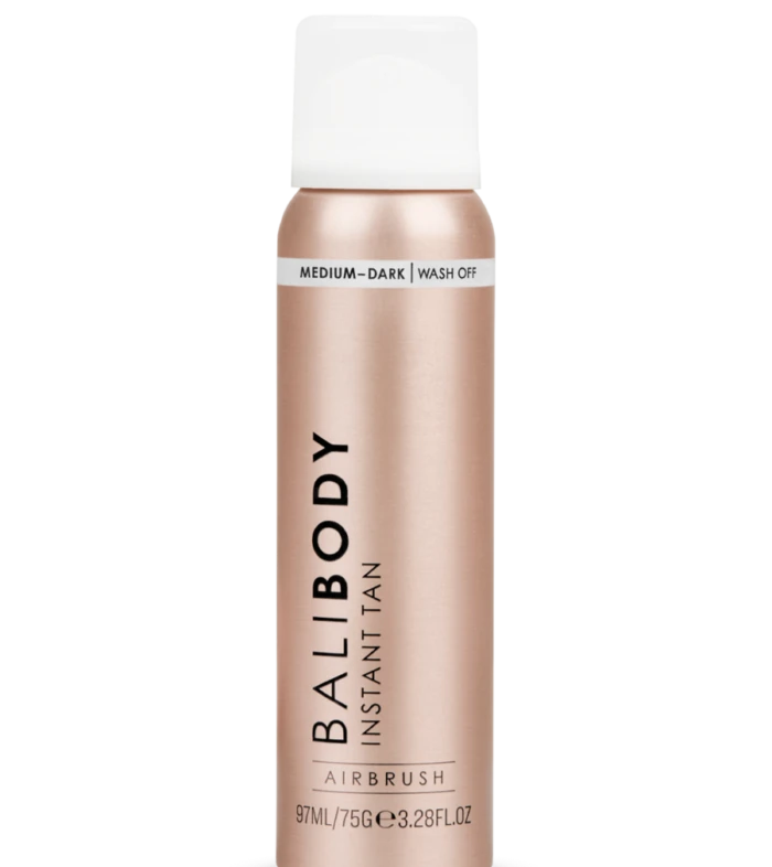 Balibody Instant Tan spray bottle in rose-gold with white cap, labeled Medium-Dark wash-off (informational product shot).