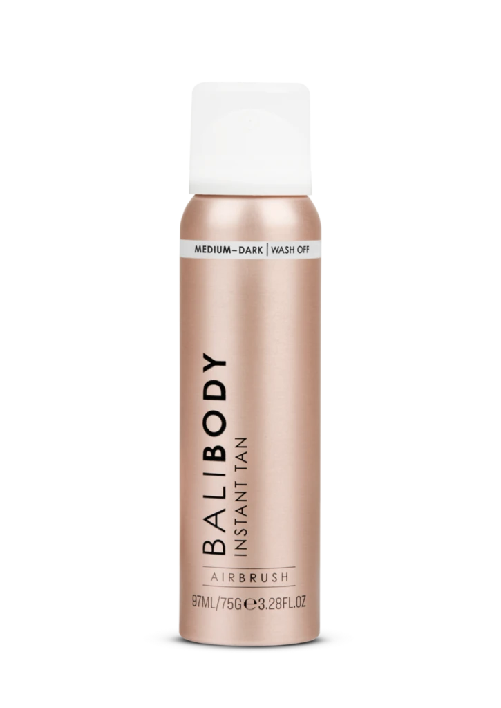 Balibody Instant Tan spray bottle in rose-gold with white cap, labeled Medium-Dark wash-off (informational product shot).