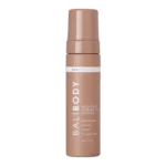 Tall bronze self-tanner mousse bottle with cap, label reads 'Dark | One Night Only' and 'Bronzing Instant Tan Mousse'