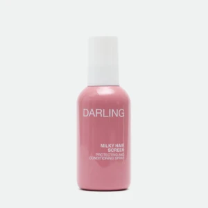 Close-up of a pink bottle with a white cap, labeled 'DARLING' with 'MILKY HAIR SCREEN' text on the label against a white background.
