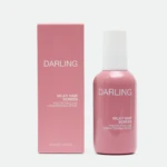 Pink box and matching pink bottle of Darling Milky Hair Screen Protecting and Conditioning Spray (150 ml) shown side by side on a light background.