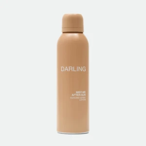 Peach-colored spray bottle with rounded cap, labeled 'DARLING', standing upright against a light background.