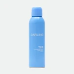 Blue cylindrical blue bottle with matching blue cap; the word 'DARLING' is visible on the bottle.