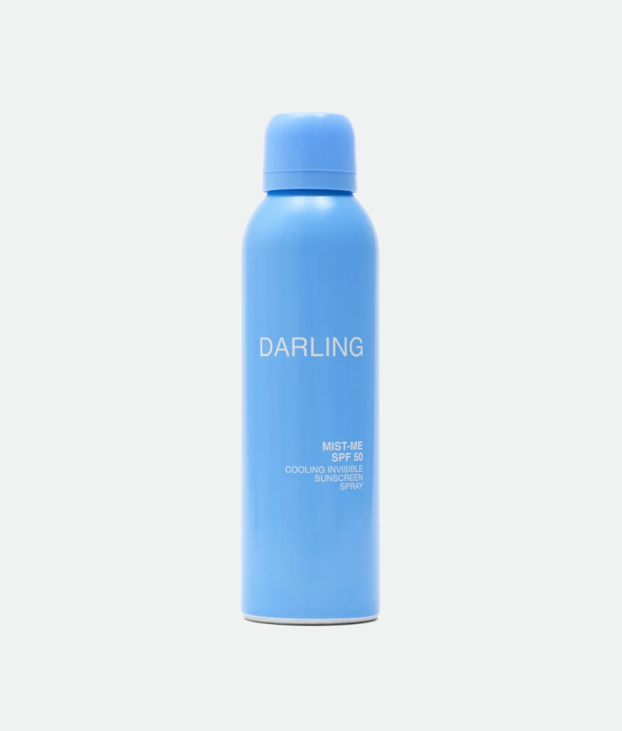 Blue cylindrical blue bottle with matching blue cap; the word 'DARLING' is visible on the bottle.