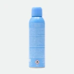 Blue aerosol spray bottle facing forward with white warning text and a hazard diamond symbol visible on the lower half of the label