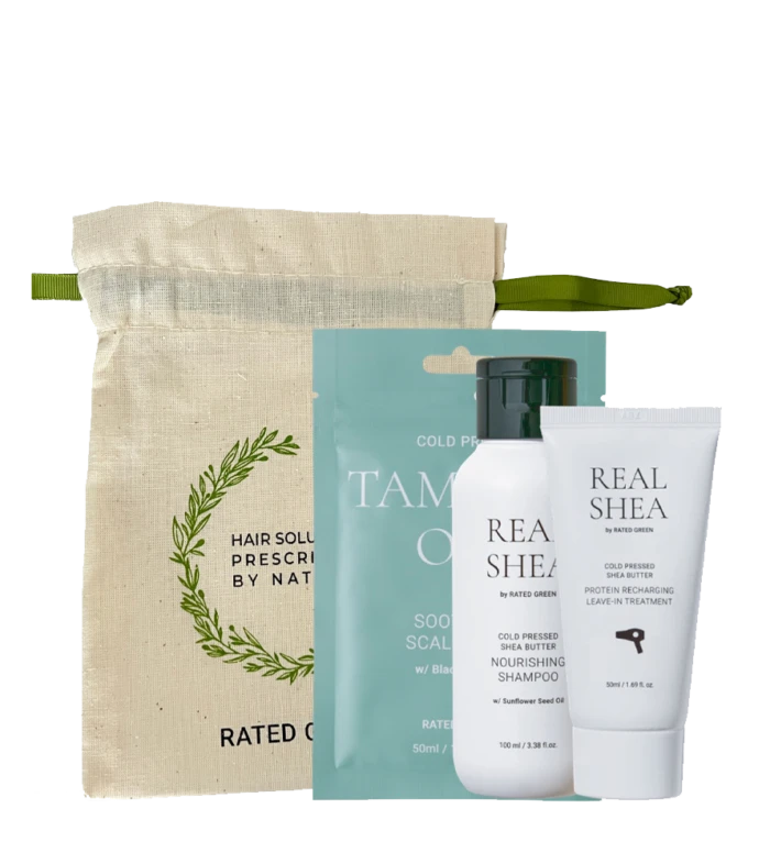 Hair care kit with a beige drawstring pouch and three Real Shea products (two bottles and a tube) in front of teal packaging behind them.