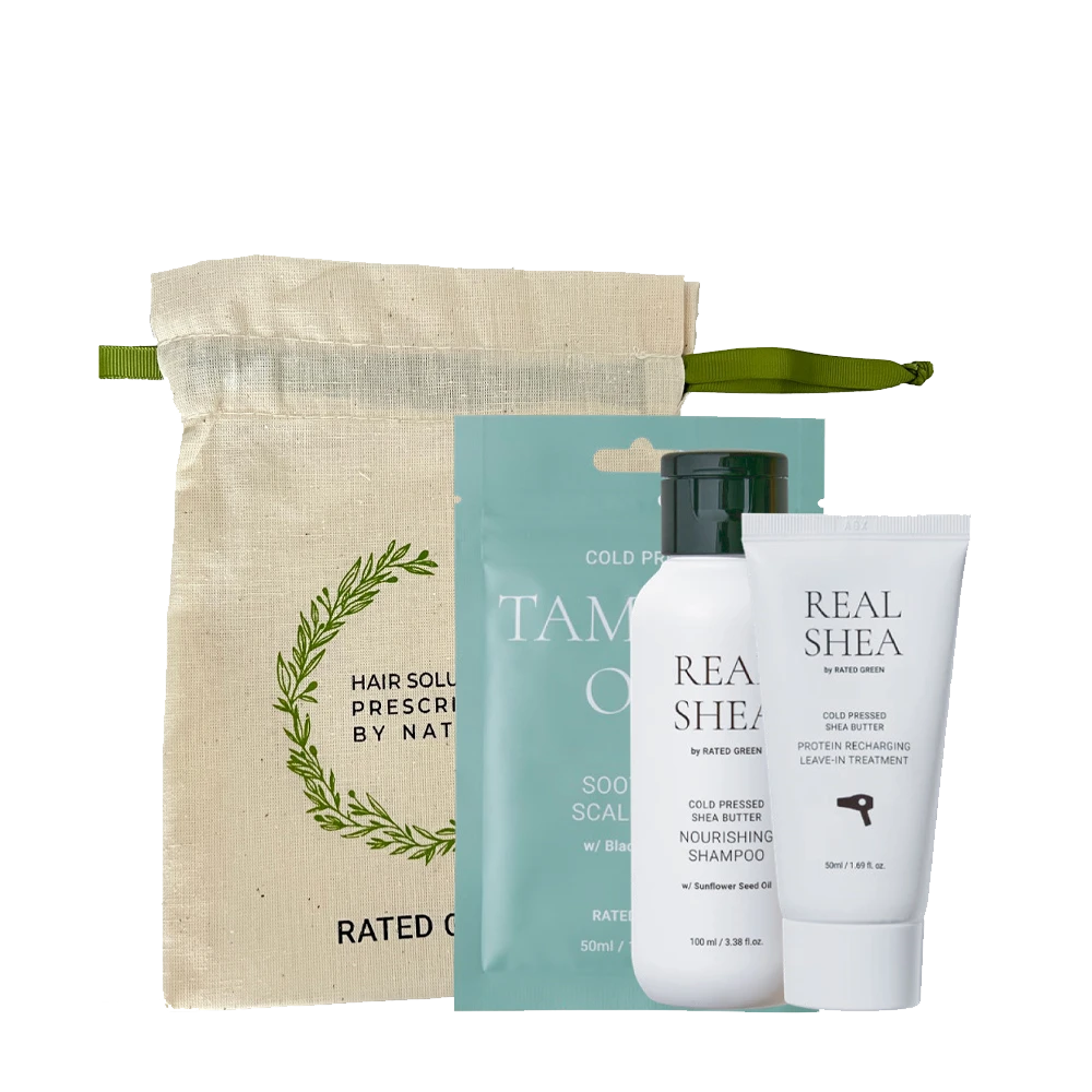 Hair care kit with a beige drawstring pouch and three Real Shea products (two bottles and a tube) in front of teal packaging behind them.