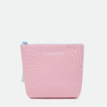 Close-up of a pink zippered pouch with a light blue zipper pull and 'DARLING' printed in white on the front.