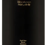 Black pump shampoo bottle with gold text: 'Take a shower, Wash off the day' and 'Dark Beer Biome Shampoo'