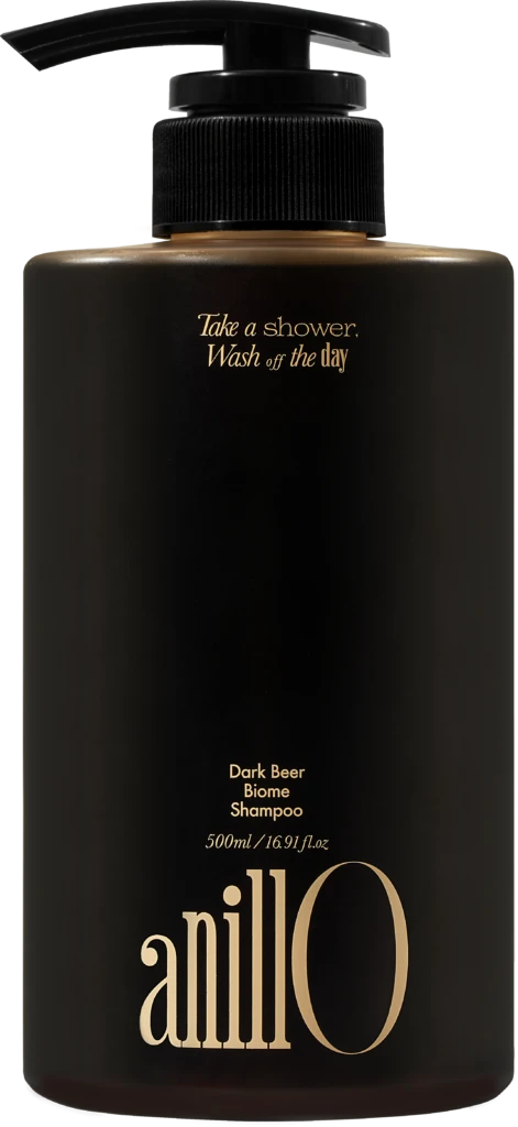 Black pump shampoo bottle with gold text: 'Take a shower, Wash off the day' and 'Dark Beer Biome Shampoo'