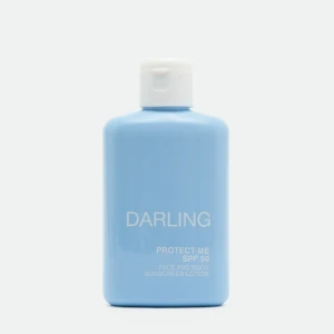 Close-up of a light blue sunscreen bottle with a white flip-top cap, showing the label 'DARLING' and 'PROTECT-ME SPF 50'.