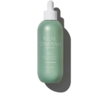Mint-green spray bottle labeled 'REAL TAMANU' with white pump, reading 'Soothing Scalp Tonic Serum' against a black background.