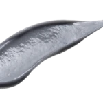 Close-up of a gray curved spoon-like utensil against a white background.