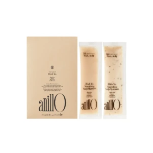 Beige box set with two matching sachets labeled Anilo Black Tea Nourishing Scalp Shampoo and Scalp Treatment.