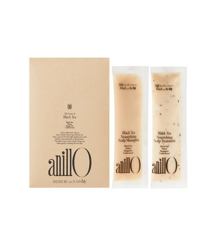 Beige box set with two matching sachets labeled Anilo Black Tea Nourishing Scalp Shampoo and Scalp Treatment.