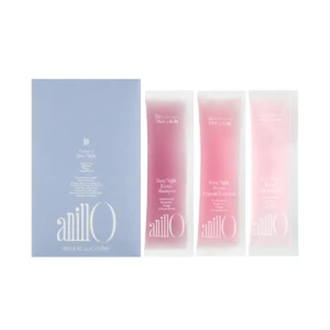 Blue box with anillo logo sits beside three pink sachets labeled Rosy Night Repair Shampoo, Ampoule Treatment, and Hair Essence on a white background.