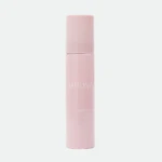 Vertical close-up of a pink cosmetic bottle with text, labeled 'DARLING' and 'SCREEN-ME SPRAY SPF 50+' (tinted skin-tone bottle)