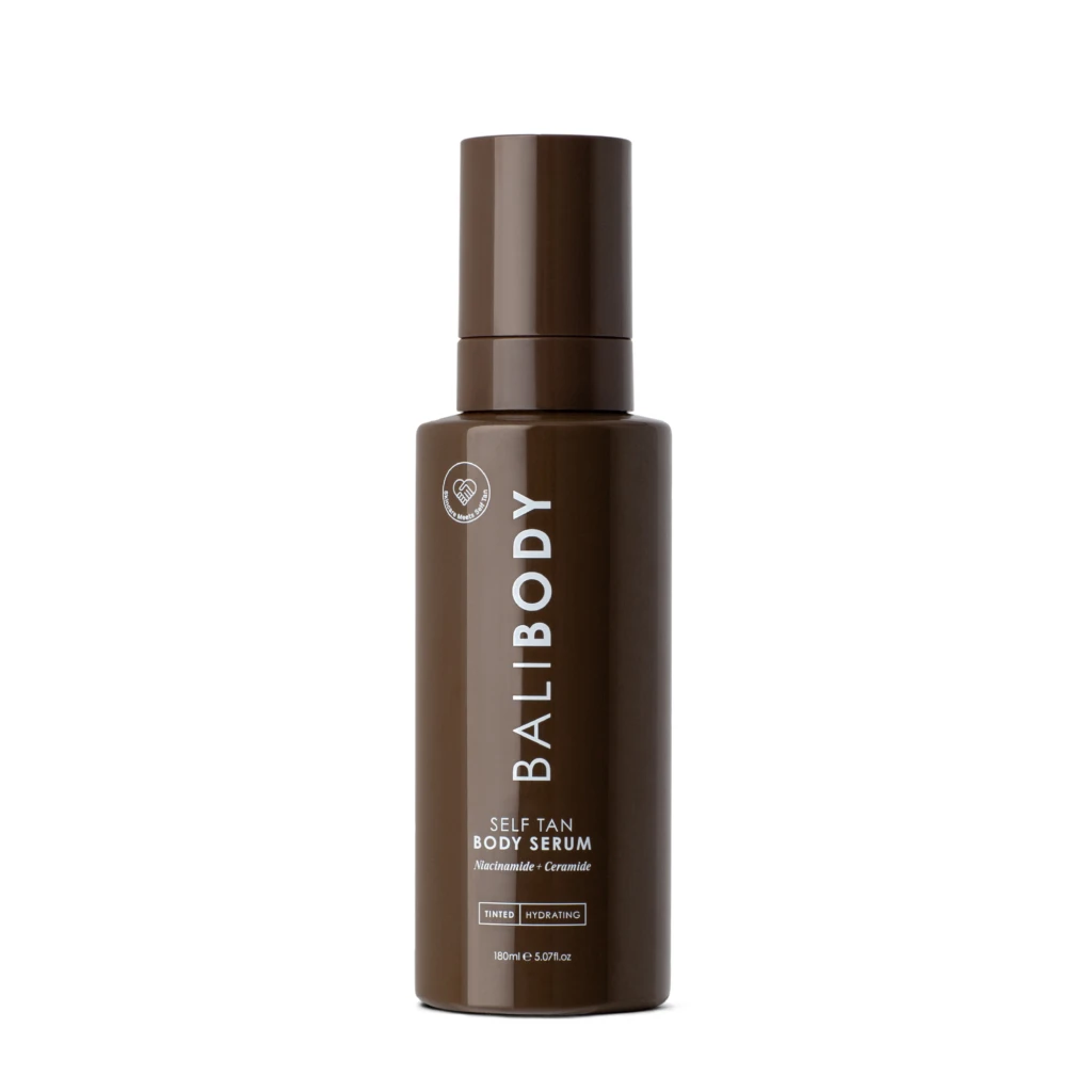 Brown pump-top bottle for Self Tan Body Serum, vertical label reading 'Self Tan Body Serum' with Niacinamide + Ceramide details on brown packaging