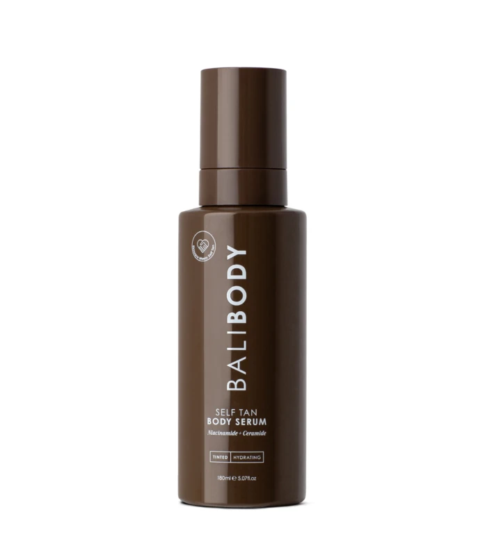 Brown pump-top bottle for Self Tan Body Serum, vertical label reading 'Self Tan Body Serum' with Niacinamide + Ceramide details on brown packaging