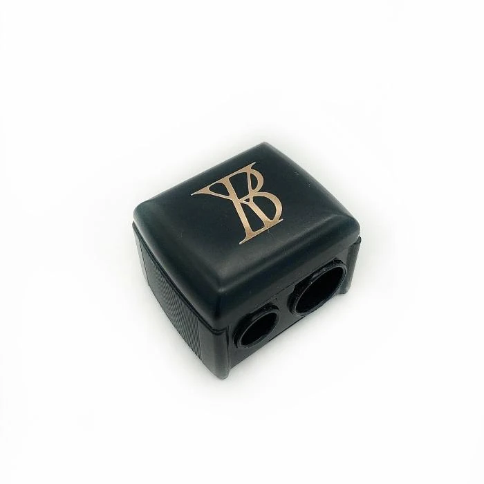 Black rectangular plastic adapter with two circular ports on one side and a gold VB logo on top.