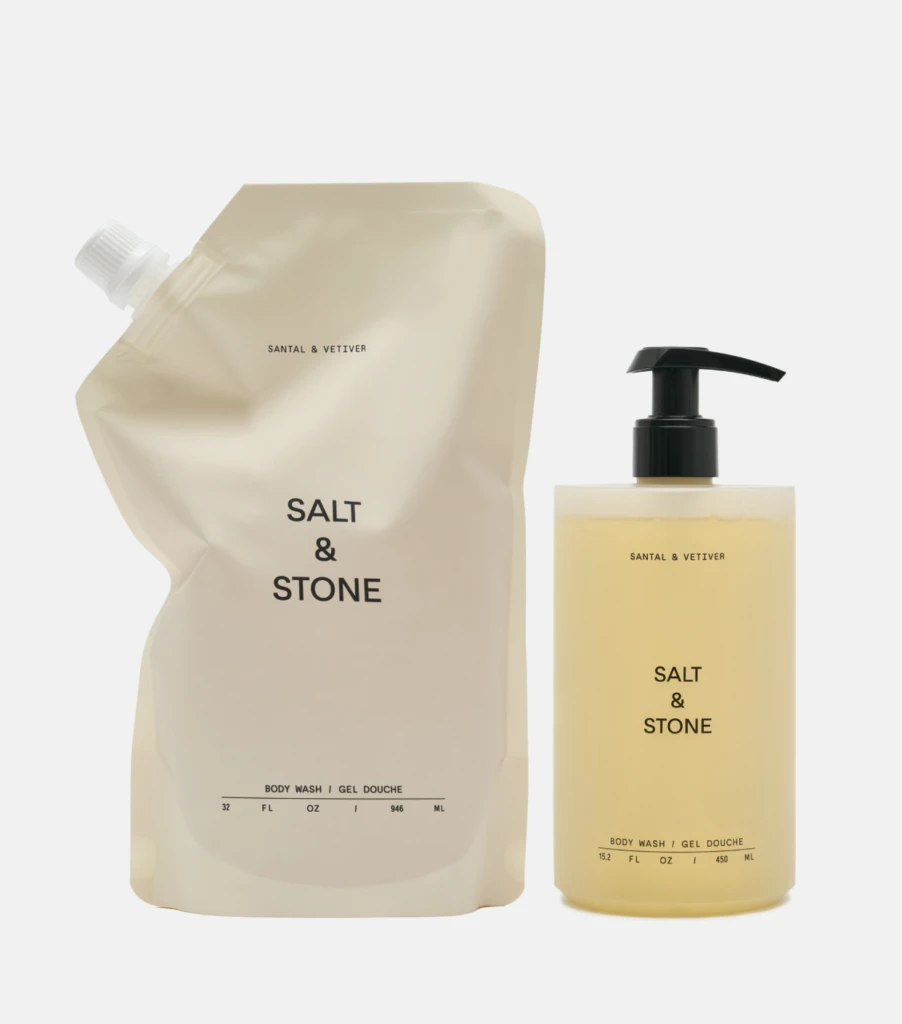 Beige Salt & Stone refill pouch and matching pump bottle of body wash with pale yellow liquid.