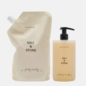 Beige Salt & Stone body wash refill pouch beside a matching pump bottle with Black Rose & Oud scent.