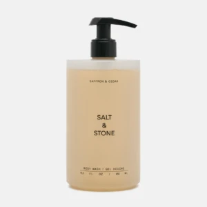 Beige Salt & Stone body wash bottle with a black pump dispenser.