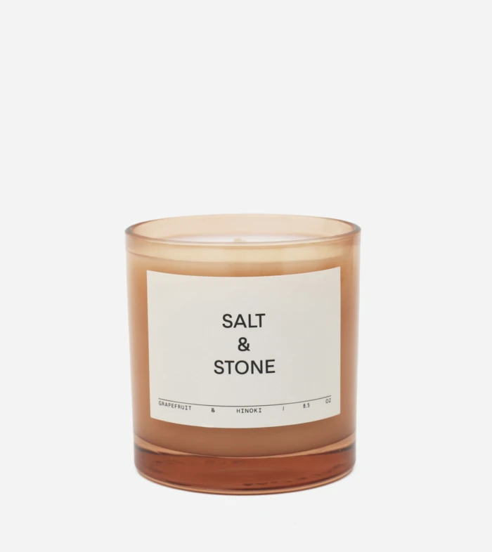 Amber glass candle jar labeled Salt & Stone, grapefruit & hinoki fragrance, 8.5 oz