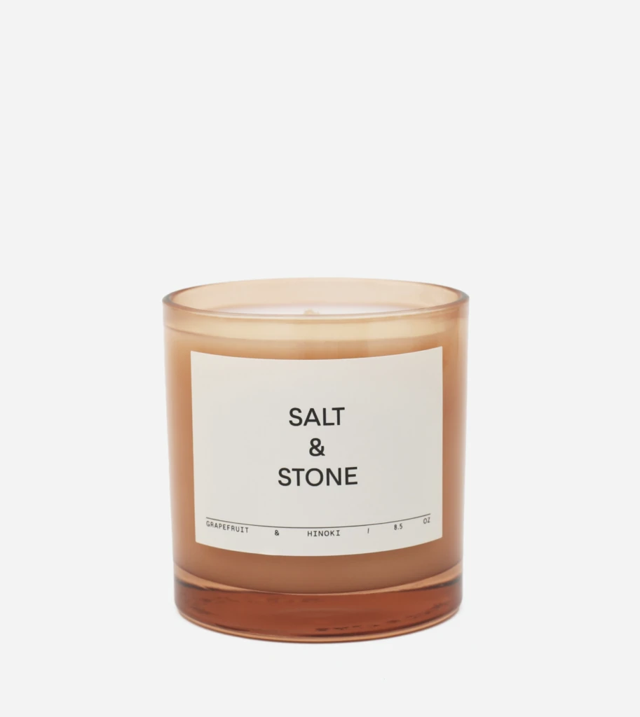 Amber glass candle jar labeled Salt & Stone, grapefruit & hinoki fragrance, 8.5 oz
