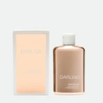 Box and bottle of Darling after-sun lotion, with pale peach label and white cap against a light background.
