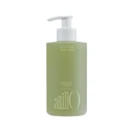Green shampoo bottle with white pump dispenser; label reads Patchouli Garden Damage Repair Shampoo and tagline about taking a shower today (informative product image).