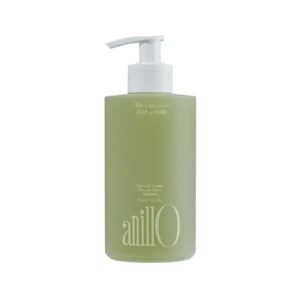 Green shampoo bottle with white pump dispenser; label reads Patchouli Garden Damage Repair Shampoo and tagline about taking a shower today (informative product image).