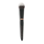 Close-up of a makeup brush with a black handle and light-to-dark bristles against a white background.